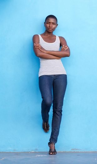 serious-woman-standing-and-staring-with-arms-cross-VDZ5NXJ